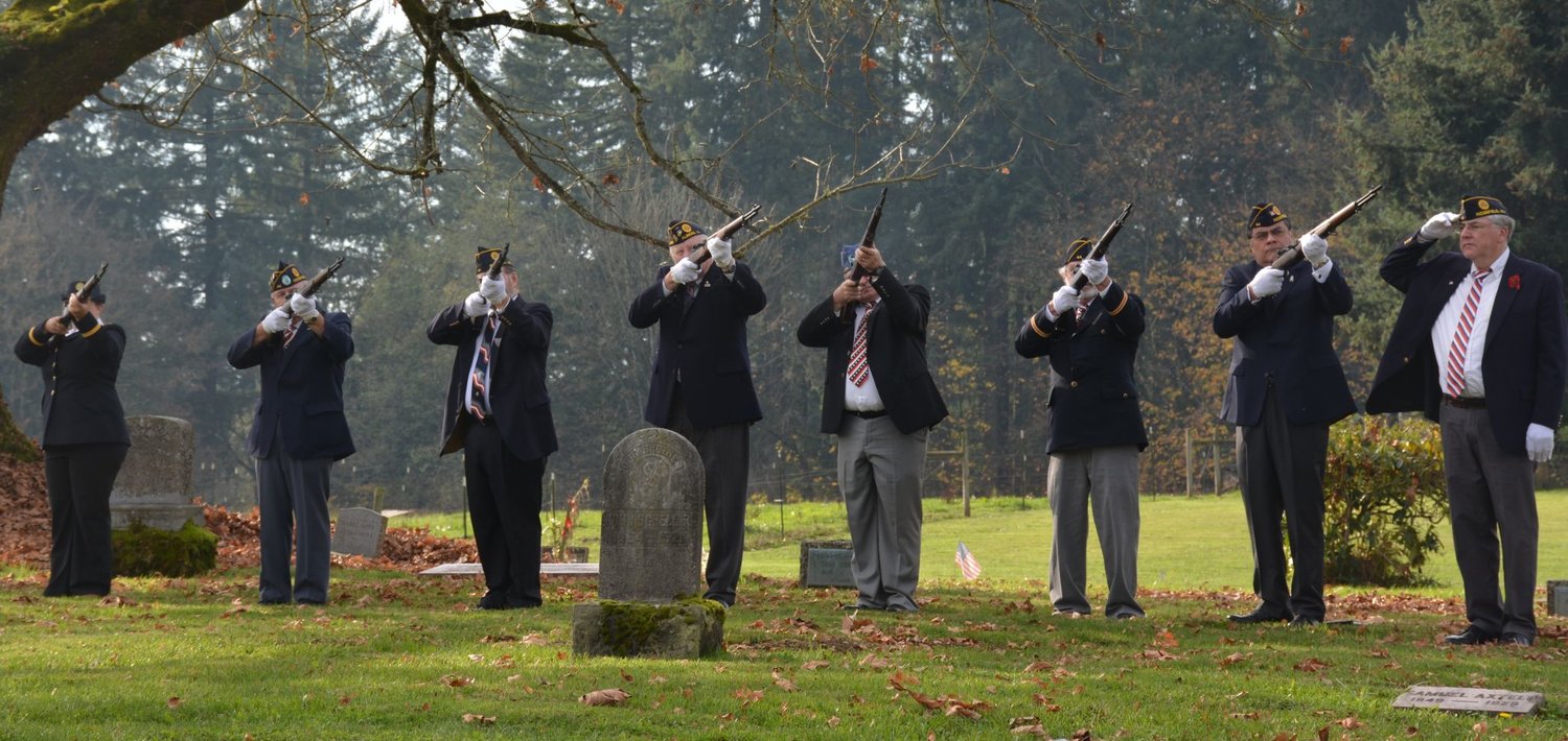 Members of the American Legion perform a 21-gun salute during a flagpole dedication ceremony at Sara Union Cemetery near Ridgefield on Veterans Day in 2016.
